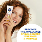 Refect Beauty Nivea Sun Anti-Age Q10 SPF 50 cream held by a smiling woman with curly hair to prevent fine lines