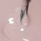Refect Beauty Astra My Laque nail polish brush applying a smooth, glossy light pink lacquer in a close-up shot.