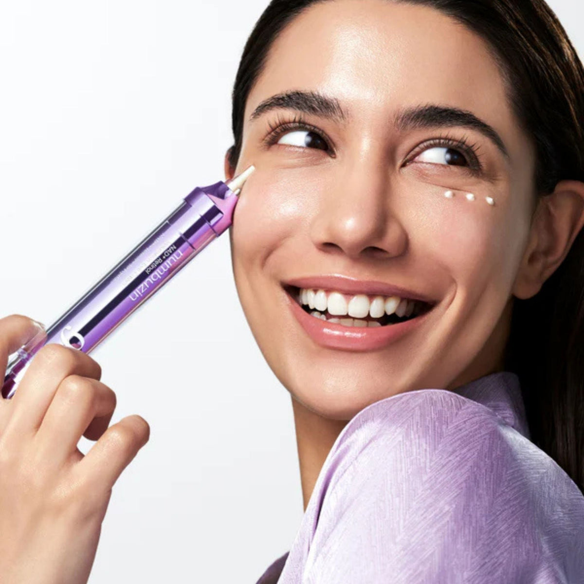 Refect Beauty model applying Numbuzin No.9 NAD+ Retinol Volumetox Eye Cream to her under-eye area for skin firming.