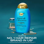 Refect Beauty OGX Renewing Argan Oil of Morocco conditioner bottle in blue with gold cap on a teal surface