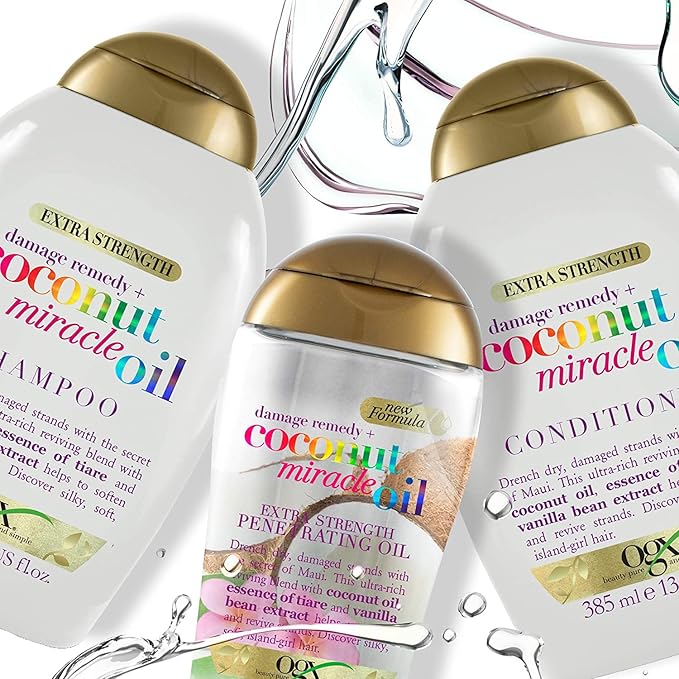 Refect Beauty collection of Ogx Coconut Miracle Oil shampoo, conditioner, and penetrating oil bottles with water splash