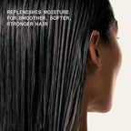 Refect Beauty model with damp hair treated with Olaplex No. 8 Bond Intense Moisture Mask for hydration and strength