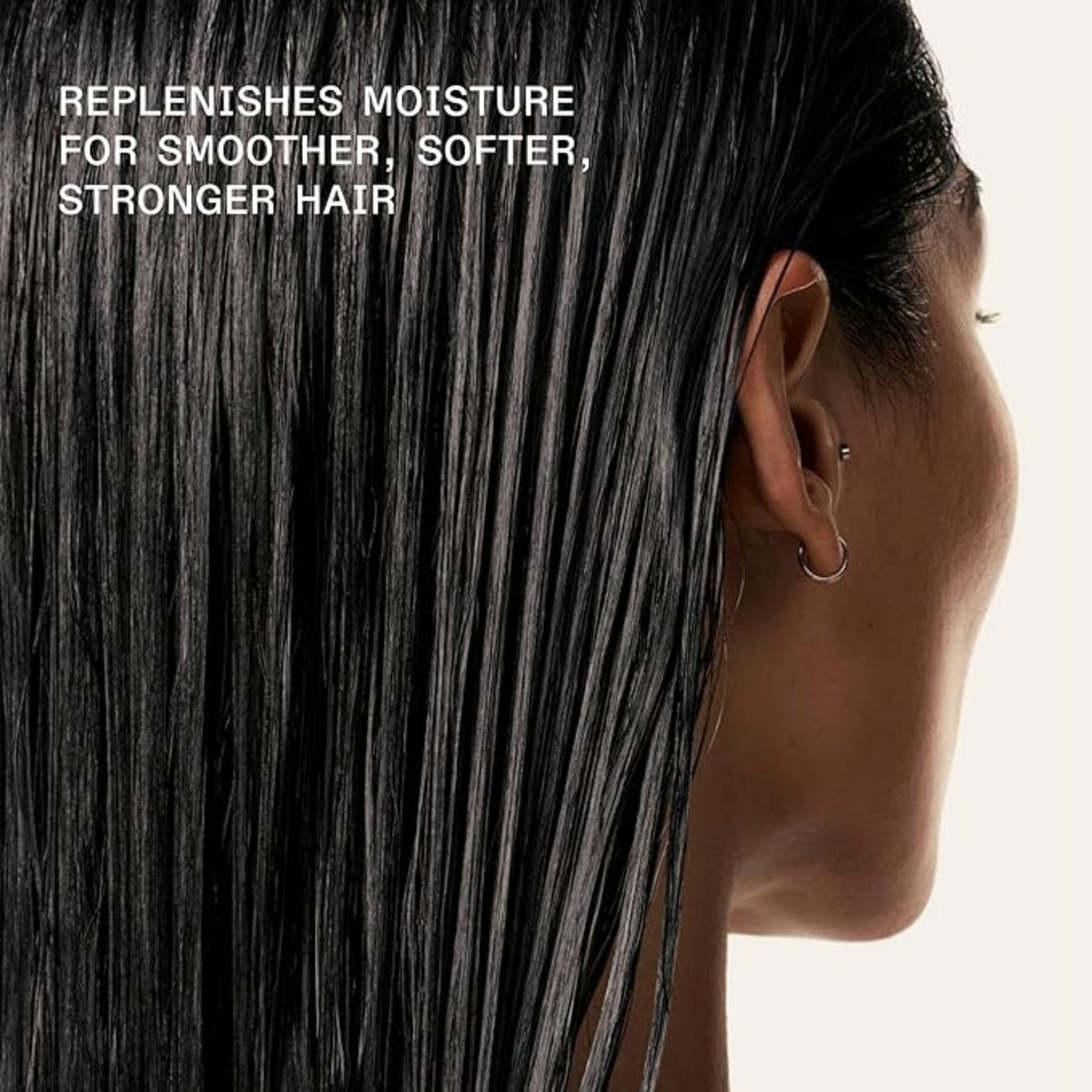 Refect Beauty model with damp hair treated with Olaplex No. 8 Bond Intense Moisture Mask for hydration and strength