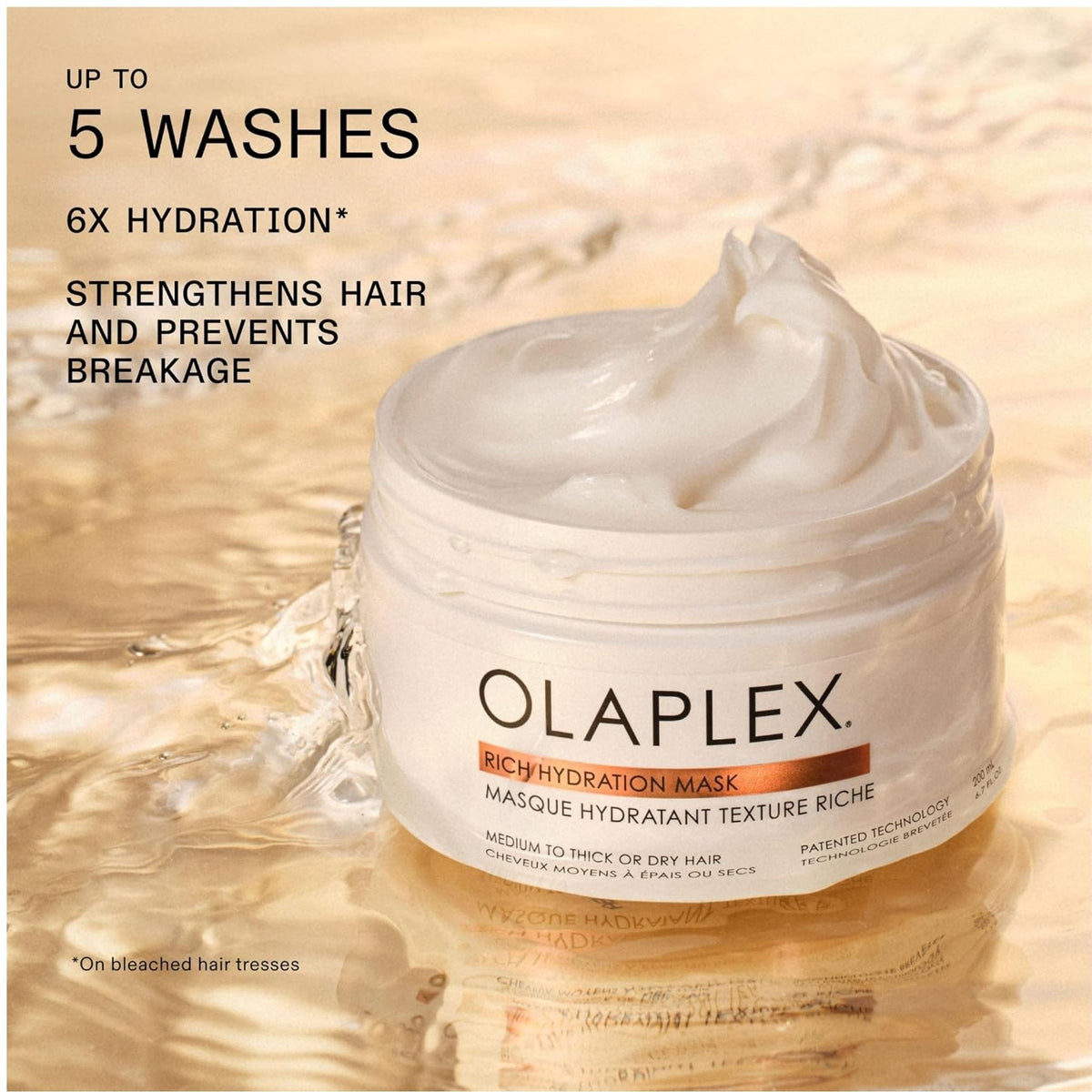 Refect Beauty Olaplex Rich Hydration Mask in a white jar with creamy product texture on a reflective water surface