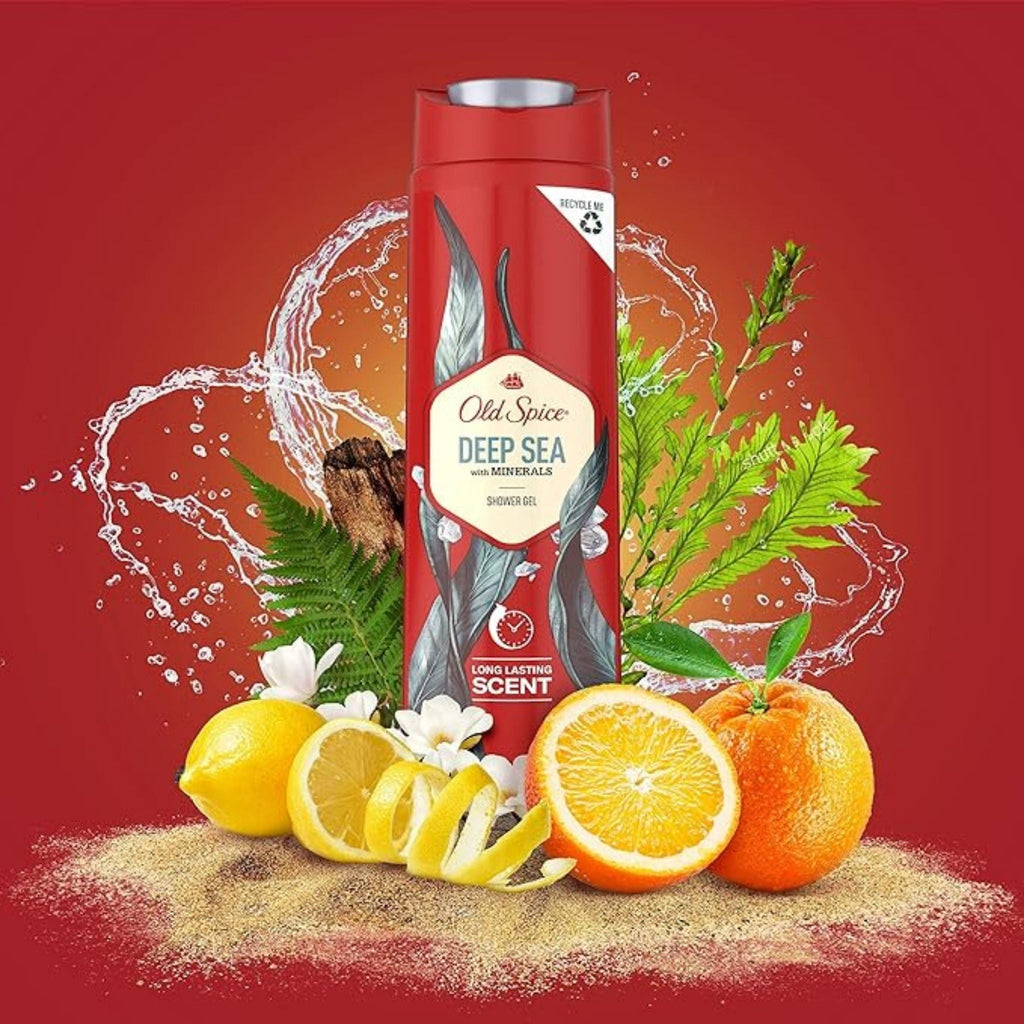Refect Beauty Old Spice Deep Sea shower gel bottle surrounded by fresh citrus fruits and green foliage on red background