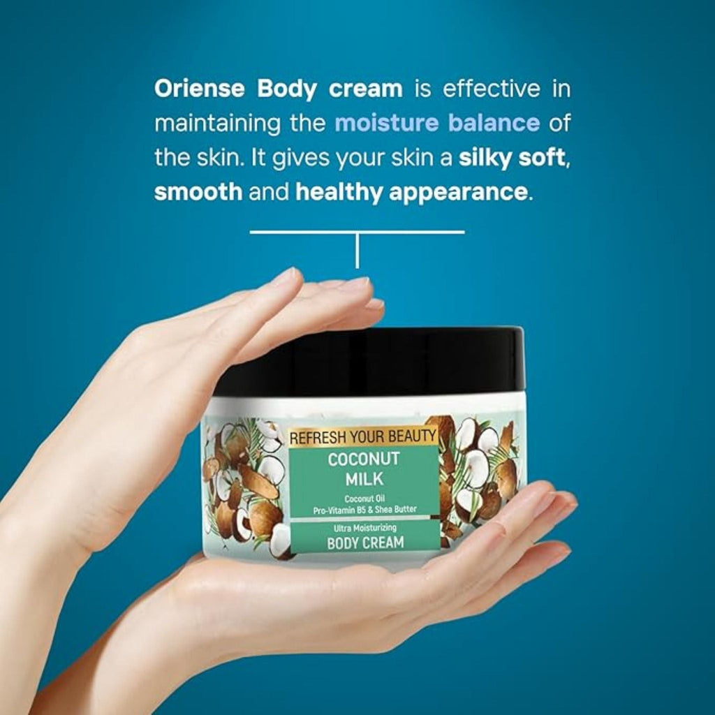 Refect Beauty Oriense Coconut Milk Body Cream jar held in hands against a blue background for deep skin hydration.