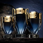 Refect Beauty Paco Rabanne Invictus Parfum bottles in three sizes with blue gradient glass and gold trophy-style caps