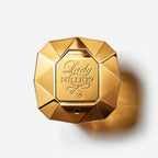 Refect Beauty Paco Rabanne Lady Million perfume bottle in a gold diamond-shaped design viewed from above