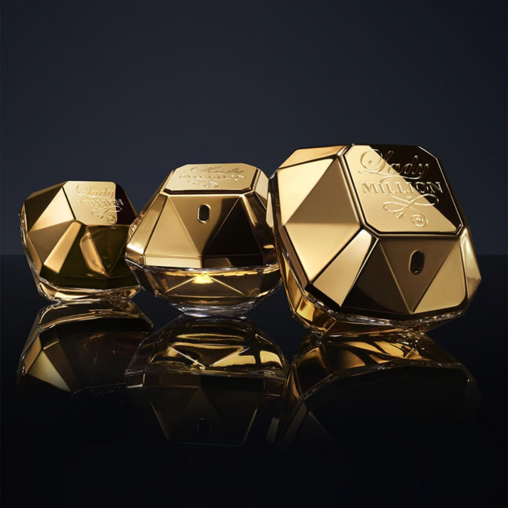 Refect Beauty Paco Rabanne Lady Million perfume gift set featuring three iconic diamond-shaped gold glass bottles.