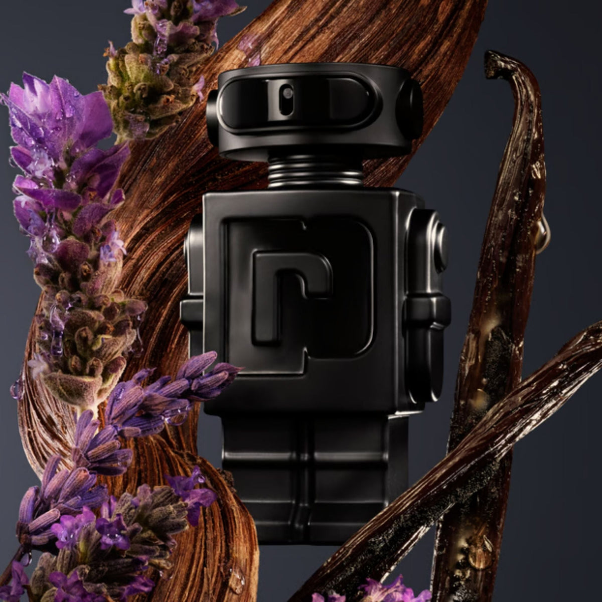 Refect Beauty Paco Rabanne Phantom Parfum bottle surrounded by lavender sprigs and vanilla beans on dark background