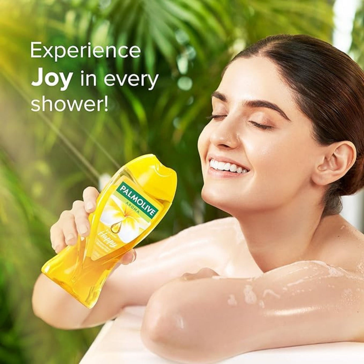 Refect Beauty woman smiling while holding a yellow Palmolive Forever Happy shower gel bottle in a tropical setting