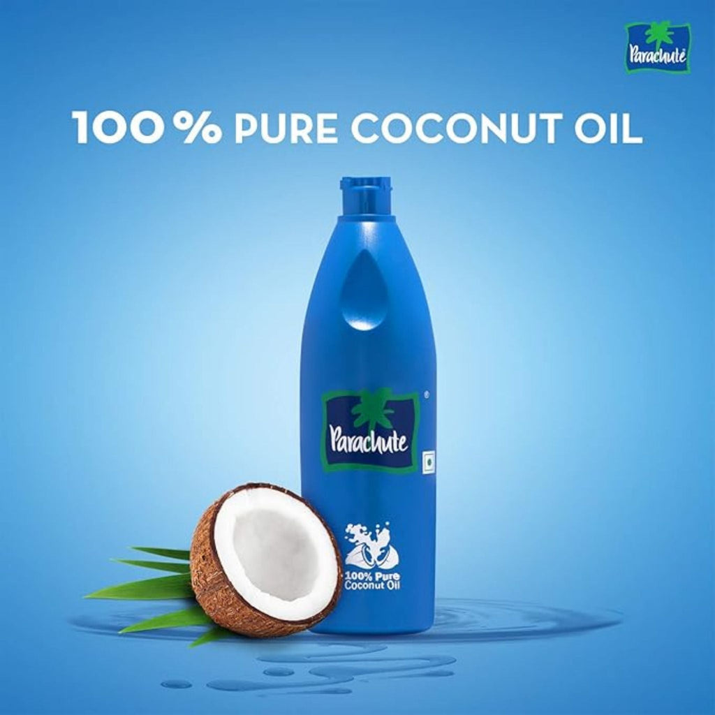 Refect Beauty Parachute 100% pure coconut oil bottle for hair and body care with a fresh coconut half on blue background