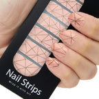 Refect Beauty Yolo nail strips featuring a soft pink geometric pattern with gold lines applied to fingernails