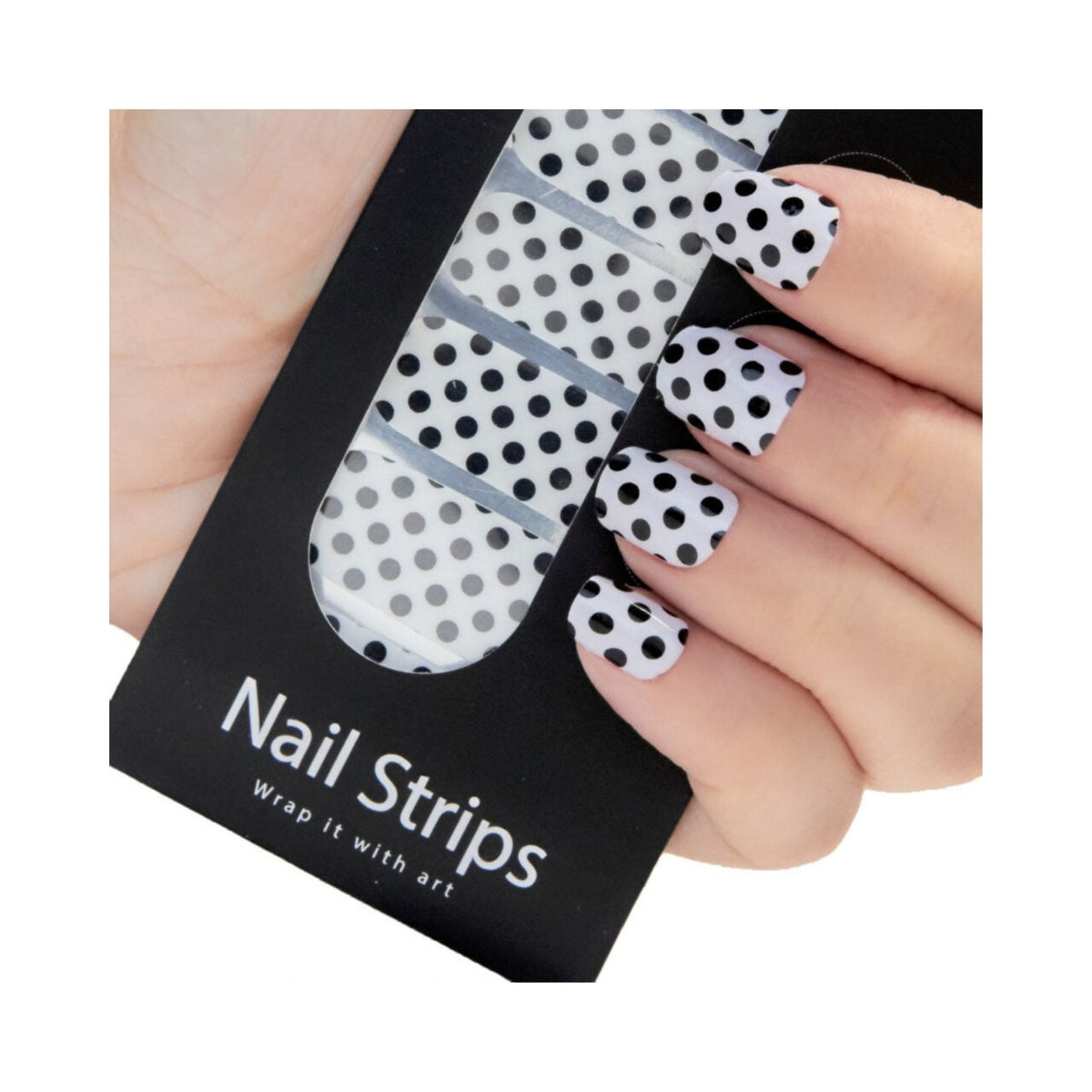Refect Beauty Yolo Nail Strips featuring a white base with black polka dot pattern applied to fingernails