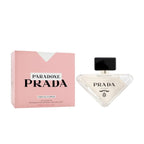 Refect Beauty Prada Paradoxe Virtual Flower perfume bottle and pink box featuring a modern triangular glass design.