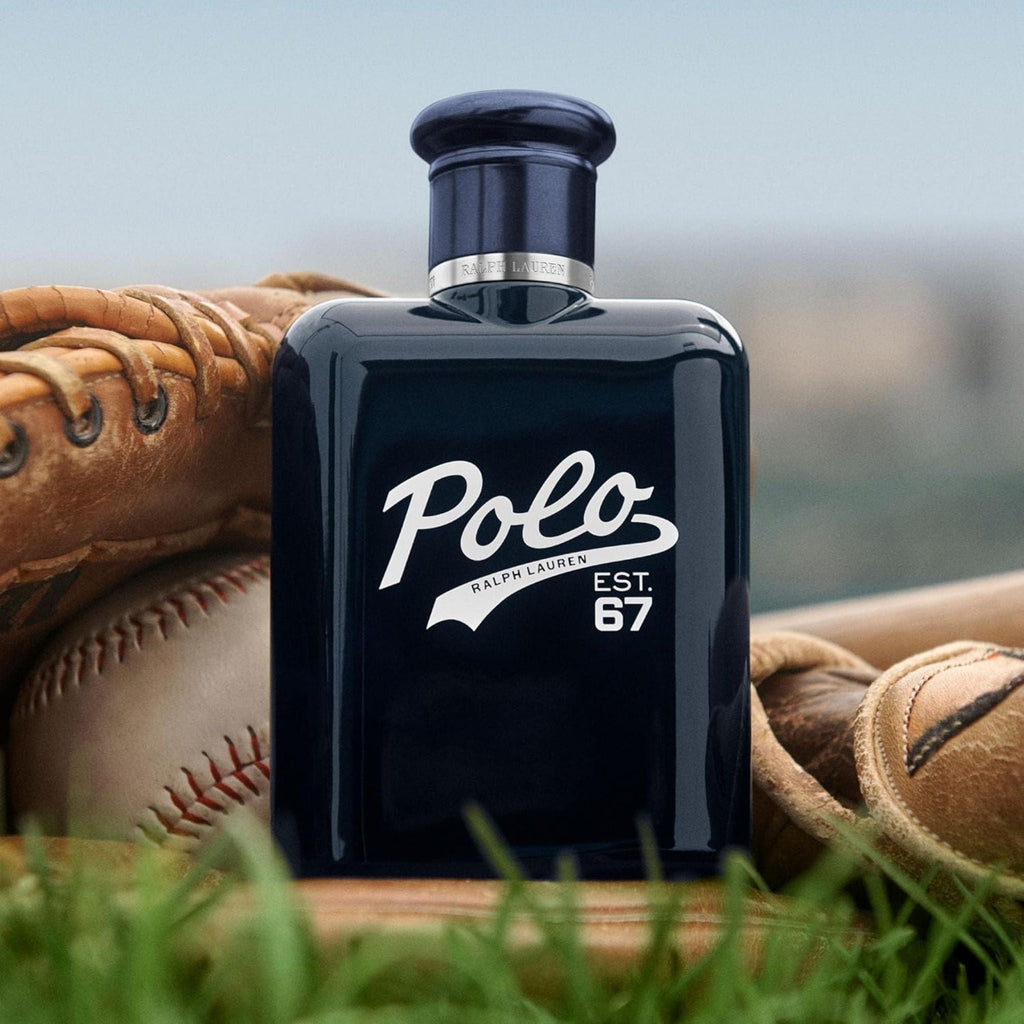 Refect Beauty Ralph Lauren Polo 67 Eau de Toilette in a dark blue bottle resting on a vintage baseball glove