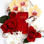 Refect Beauty Elizabeth Arden Red Door Eau de Toilette bottle surrounded by red roses and yellow orchids