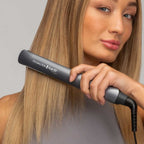 Refect Beauty Remington Keratin Protect hair straightener being used by a woman to style her long, smooth blonde hair.