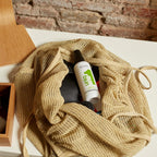 Refect Beauty Revlon Uniq One Green Tea leave-in hair treatment spray bottle inside a beige mesh tote bag