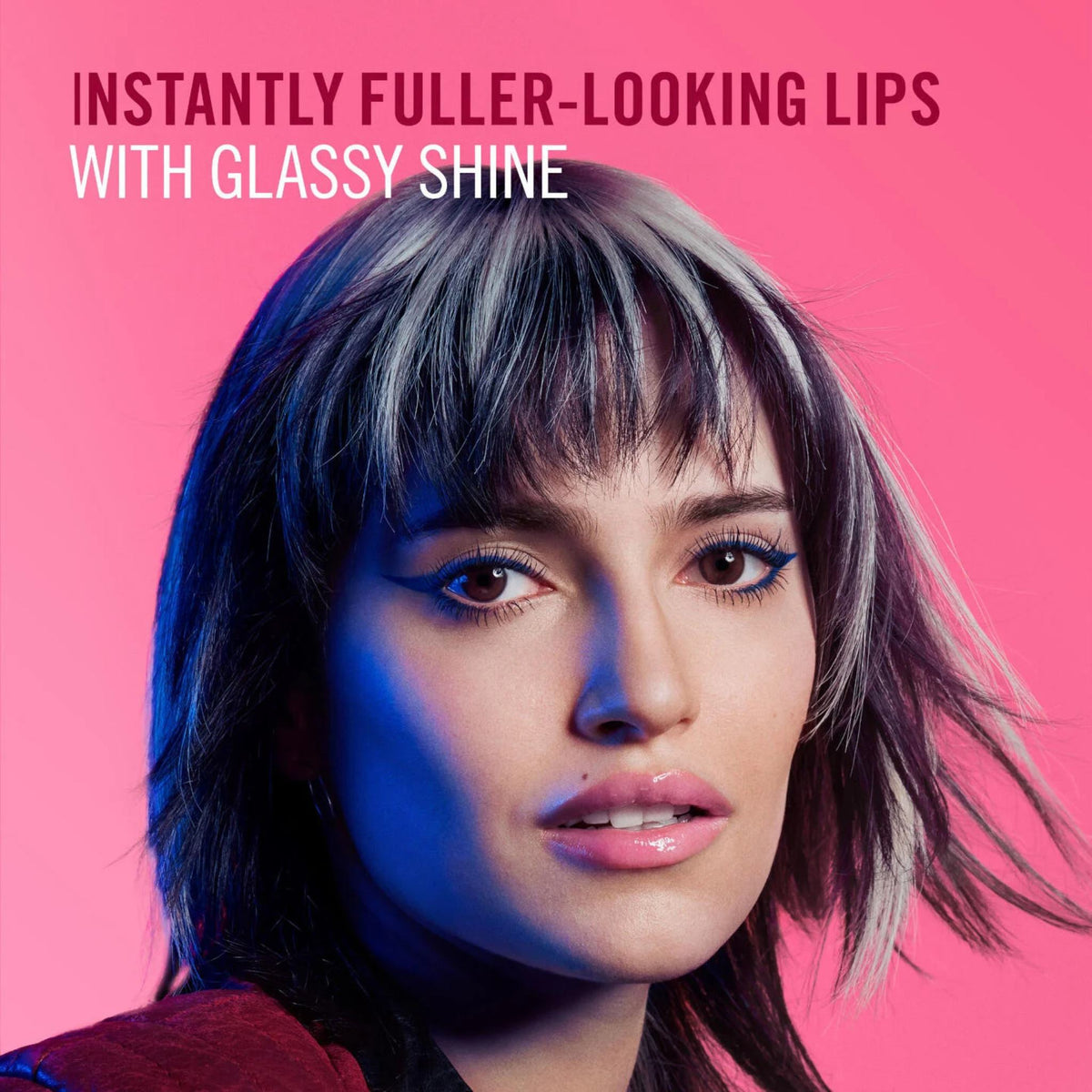 Refect Beauty model with glossy lips and blue eyeliner against a vibrant pink background for Rimmel Thrill Seeker