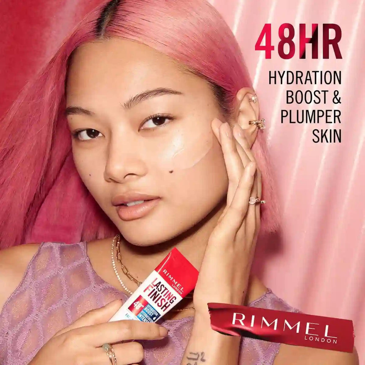 Refect Beauty model applying Rimmel Lasting Finish 48 Hour Hydration Boost Primer to her cheek for a glowing finish