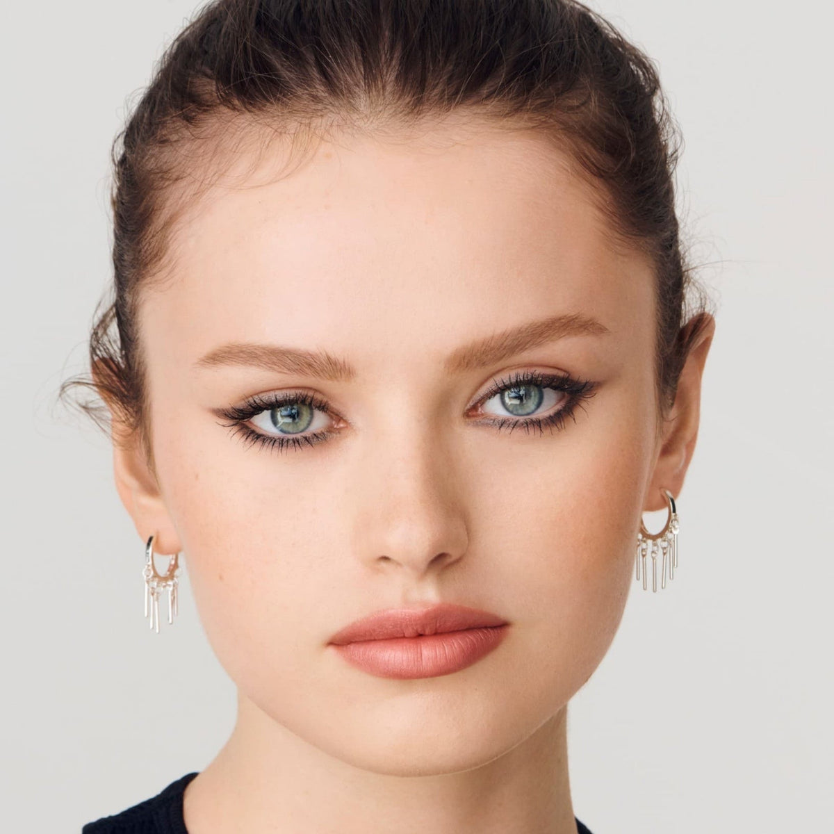 Refect Beauty model wearing bold winged eyeliner applied with Rimmel London Scandaleyes Exaggerate Eye Definer