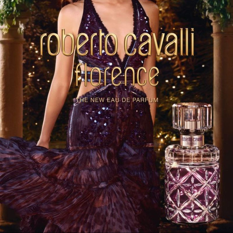 Refect Beauty Roberto Cavalli Florence Eau de Parfum bottle next to a woman in a dark sequined evening gown