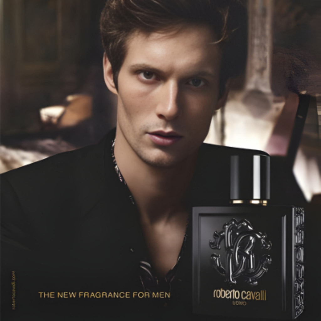 Refect Beauty presents Roberto Cavalli Uomo eau de toilette featuring a man in a black suit next to the perfume bottle