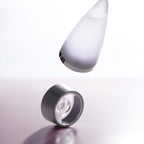 Refect Beauty Rochas Man Eau de Toilette bottle and cap floating against a soft light background