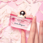 Refect Beauty Salvatore Ferragamo Signorina In Fiore perfume bottle with a pink bow on a background of flower petals