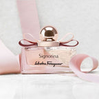 Refect Beauty Salvatore Ferragamo Signorina Eau de Parfum bottle with a pink ribbon bow on a white surface