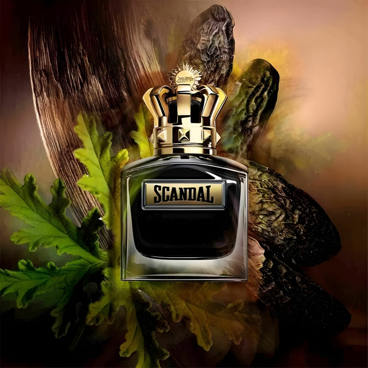 Refect Beauty Jean Paul Gaultier Scandal Pour Homme Le Parfum bottle with a gold crown cap against a botanical backdrop