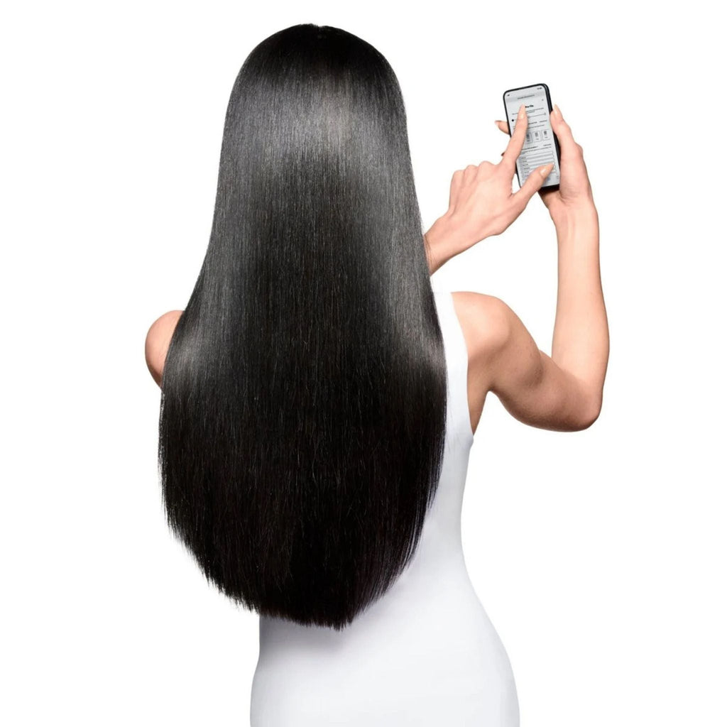 Refect Beauty model with long, shiny, healthy black hair seen from behind, showcasing vibrant color-treated hair.