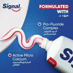 Refect Beauty Signal Cavity Fighter toothpaste tube dispensing red and white striped mint paste with fluoride complex