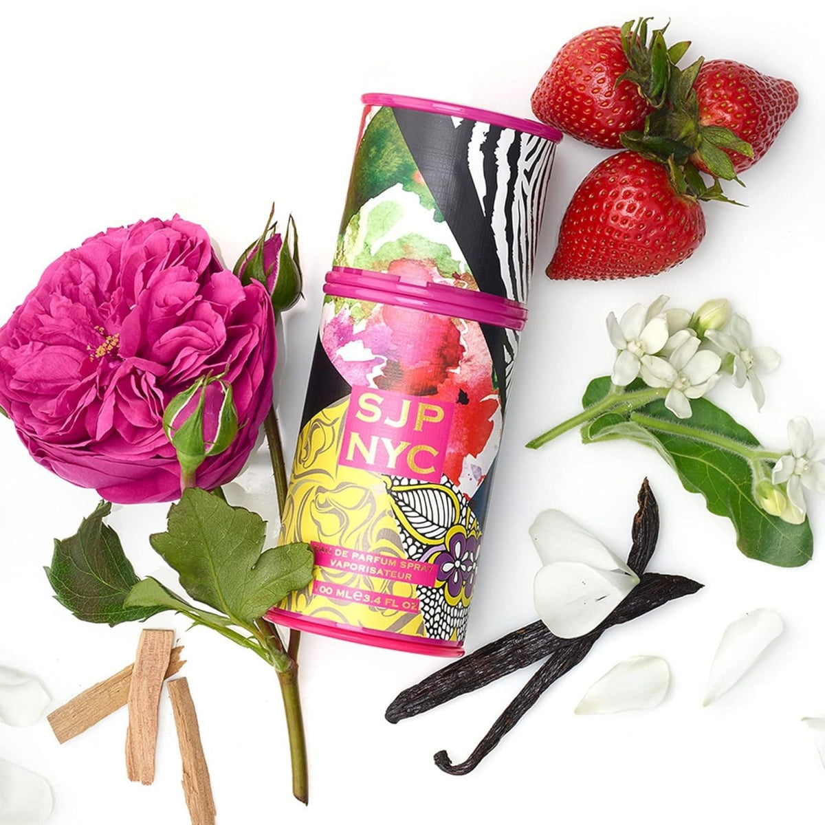 Refect Beauty Sarah Jessica Parker SJP NYC perfume bottle surrounded by fresh strawberries, a pink rose, and vanilla.