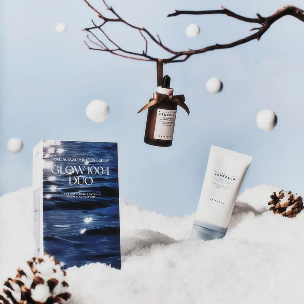 Refect Beauty SKIN1004 Madagascar Centella Glow 1004 Duo set featuring an ampoule and sun serum in a snowy setting.