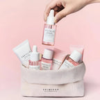 Refect Beauty SKIN1004 Centella Poremizing travel skincare set with pink bottles and tubes in a small canvas pouch.