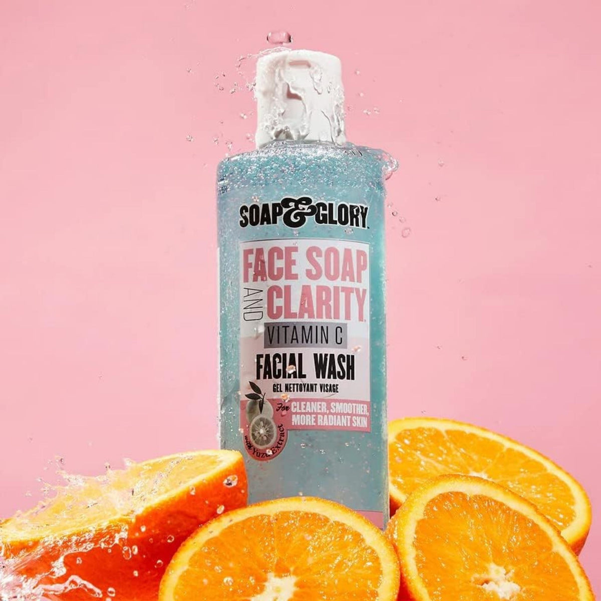 Refect Beauty Soap & Glory Face Soap and Clarity Vitamin C facial wash bottle surrounded by fresh orange slices