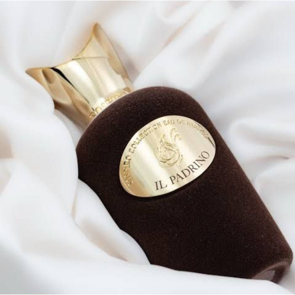 Refect Beauty Sospiro Il Padrino Eau de Parfum in a dark brown velvet bottle with a gold cap on white fabric.