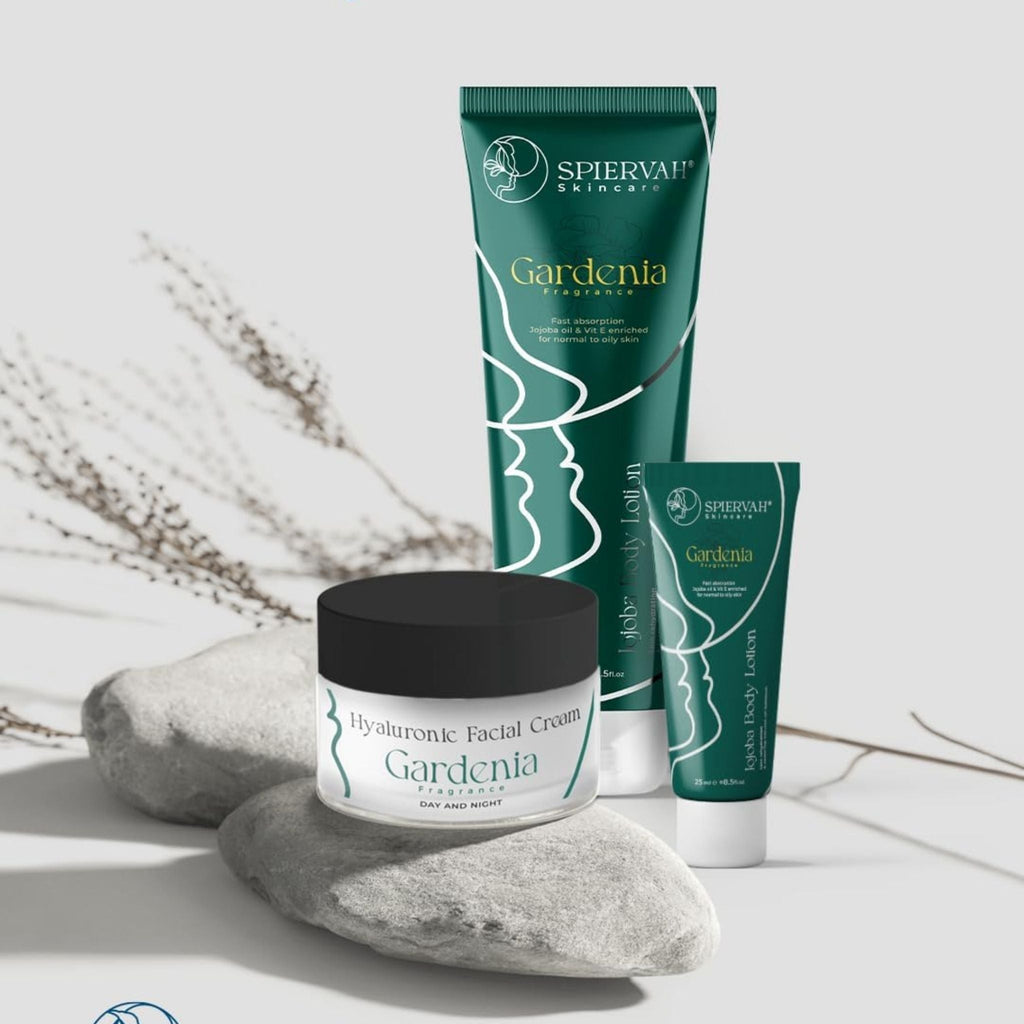 Refect Beauty Spiervah Gardenia body lotion tubes and facial cream jar displayed on decorative stones.
