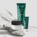 Refect Beauty Spiervah Gardenia body lotion tubes and facial cream jar displayed on decorative stones.