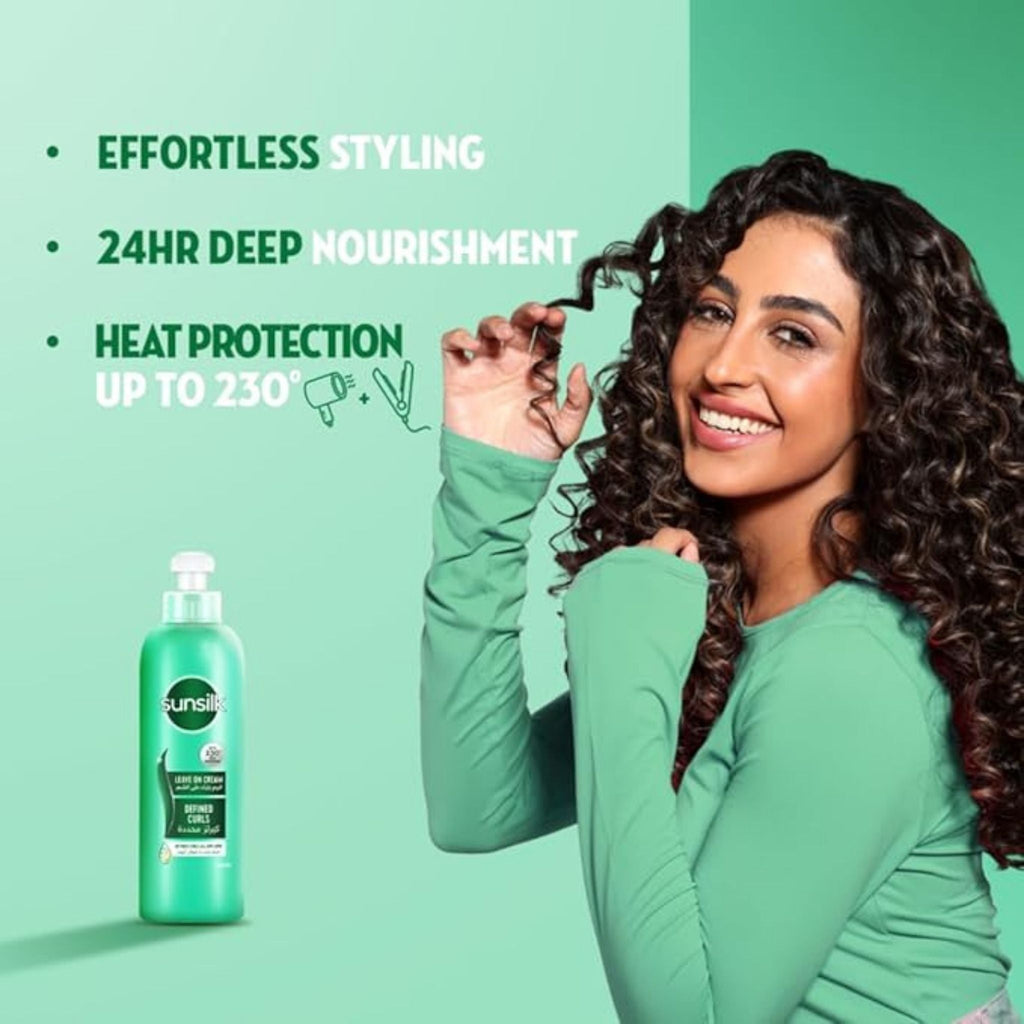 Refect Beauty Sunsilk Defined Curls leave-in cream bottle next to a smiling woman with voluminous curly hair