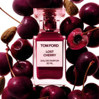 Refect Beauty Tom Ford Lost Cherry Eau de Parfum bottle surrounded by fresh black cherries and almonds