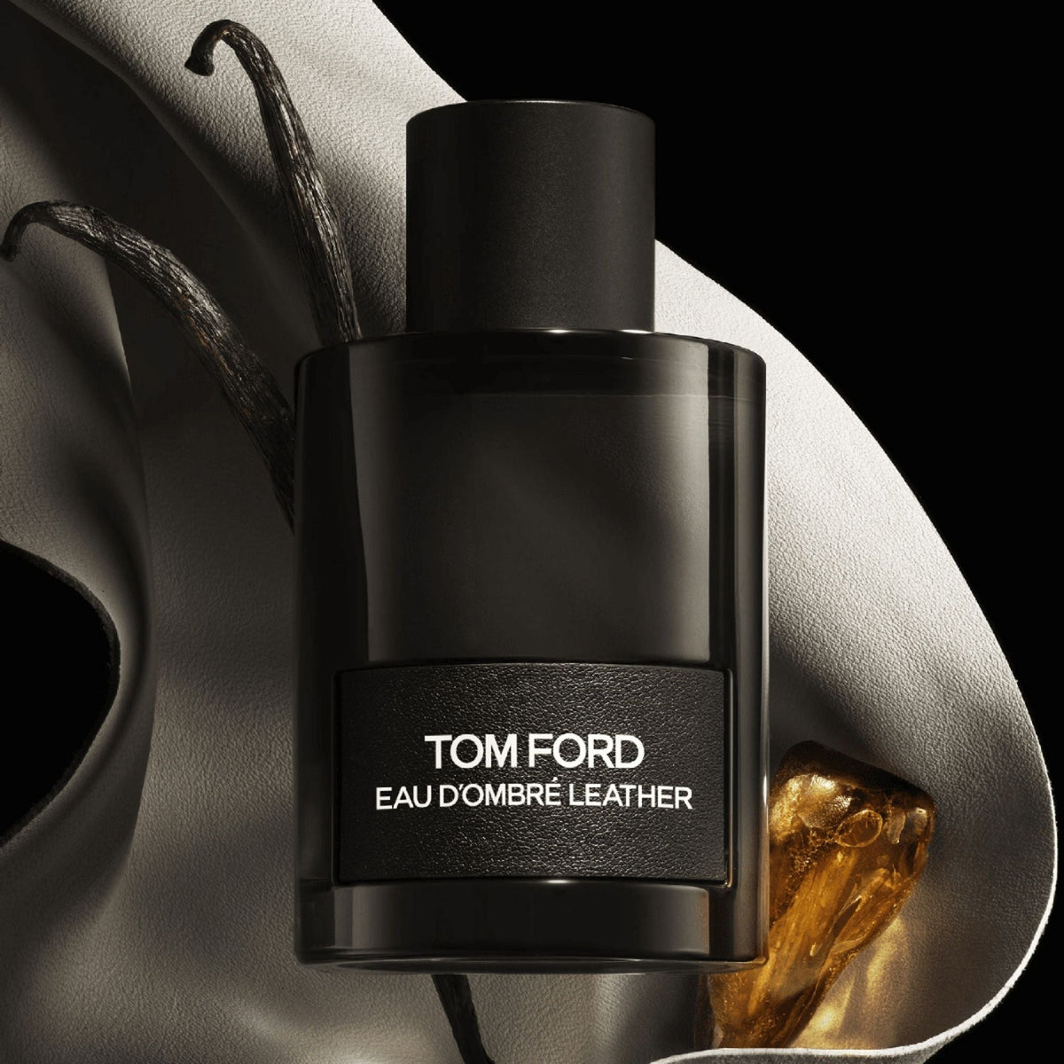 Refect Beauty Tom Ford Eau d'Ombré Leather fragrance bottle with leather texture and amber accents on black background