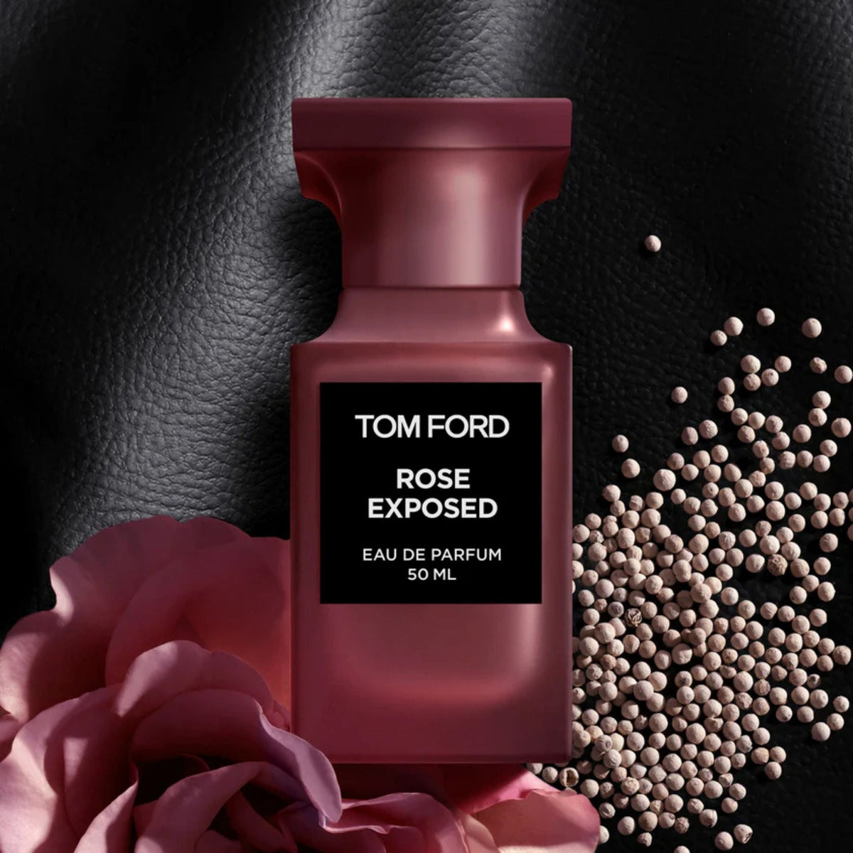 Refect Beauty Tom Ford Rose Exposed unisex eau de parfum bottle with rose petals and peppercorns on black leather