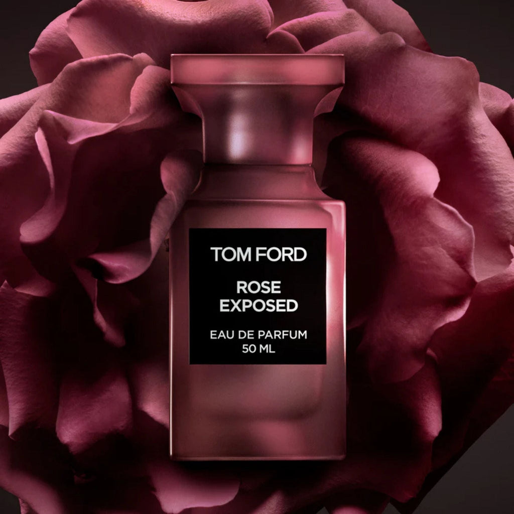 Refect Beauty Tom Ford Rose Exposed Eau de Parfum bottle set against a dark, dramatic deep red rose background.