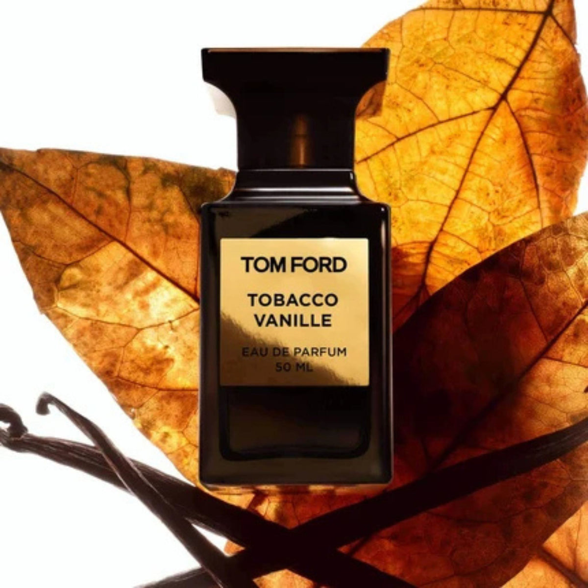Refect Beauty Tom Ford Tobacco Vanille Eau de Parfum bottle set against autumn leaves and vanilla beans