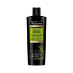 Refect Beauty TRESemmé Flawless Curls shampoo bottle with shea butter for defined, hydrated curly hair.