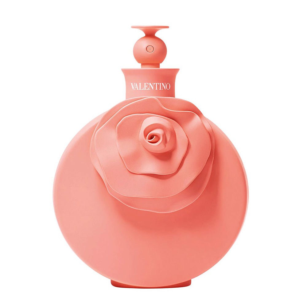 Refect Beauty Valentino Blush eau de parfum in a round coral pink bottle featuring a prominent 3D rose design