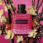 Refect Beauty Valentino Donna Born in Roma Extradose Parfum bottle surrounded by vanilla flowers and blackcurrants.